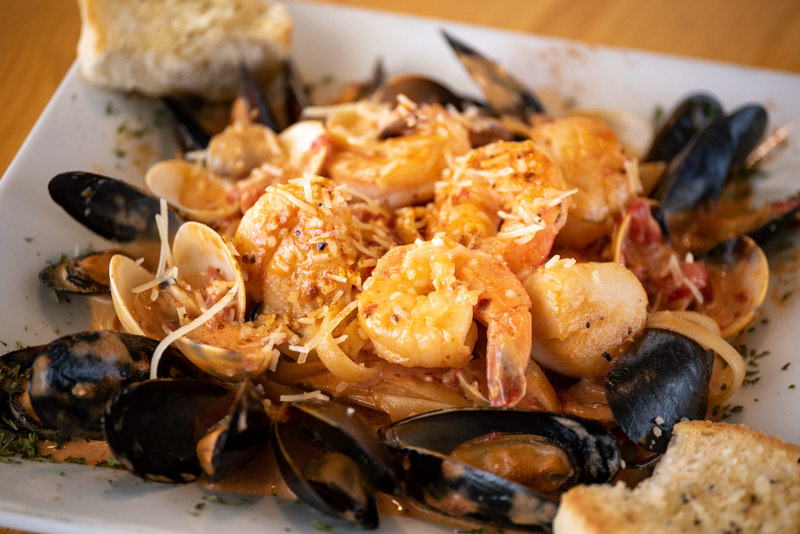 A generous Chesapeake seafood pasta with shrimp, scallops, mussels, and clams